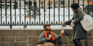 Woman giving man food on a streetlink outreach shift