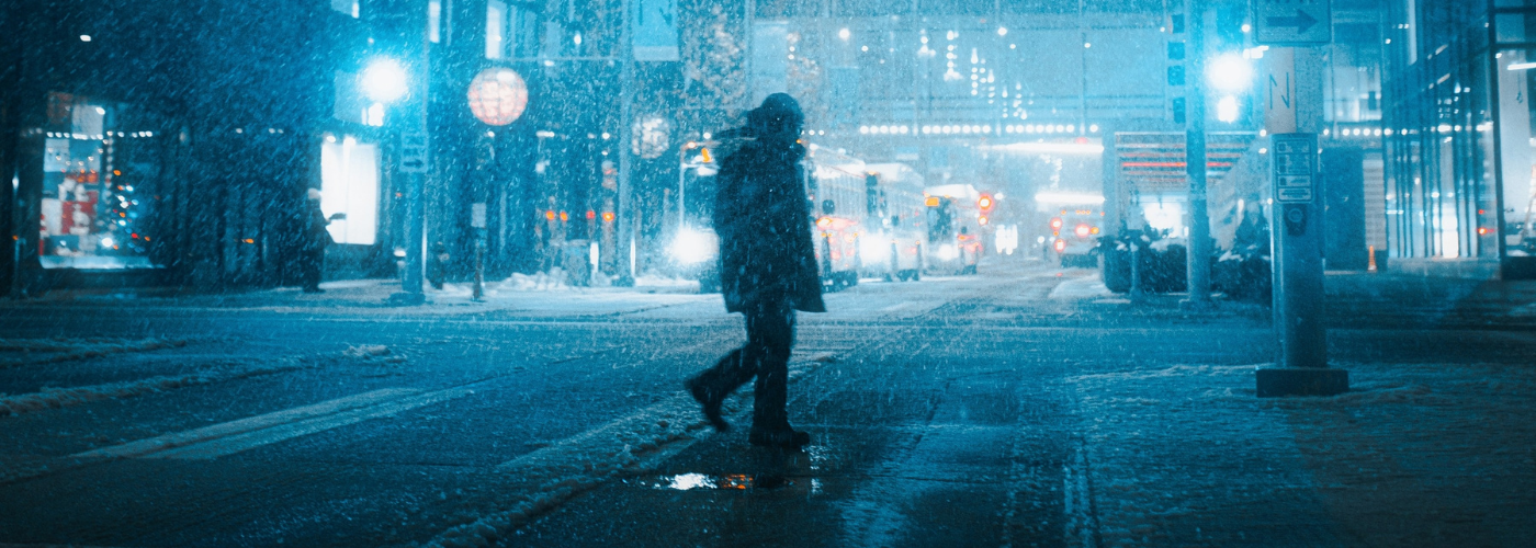 man in snow at night