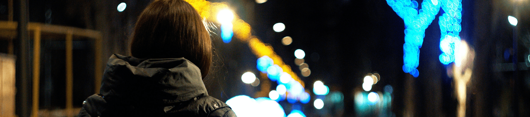 women at night standing on the street