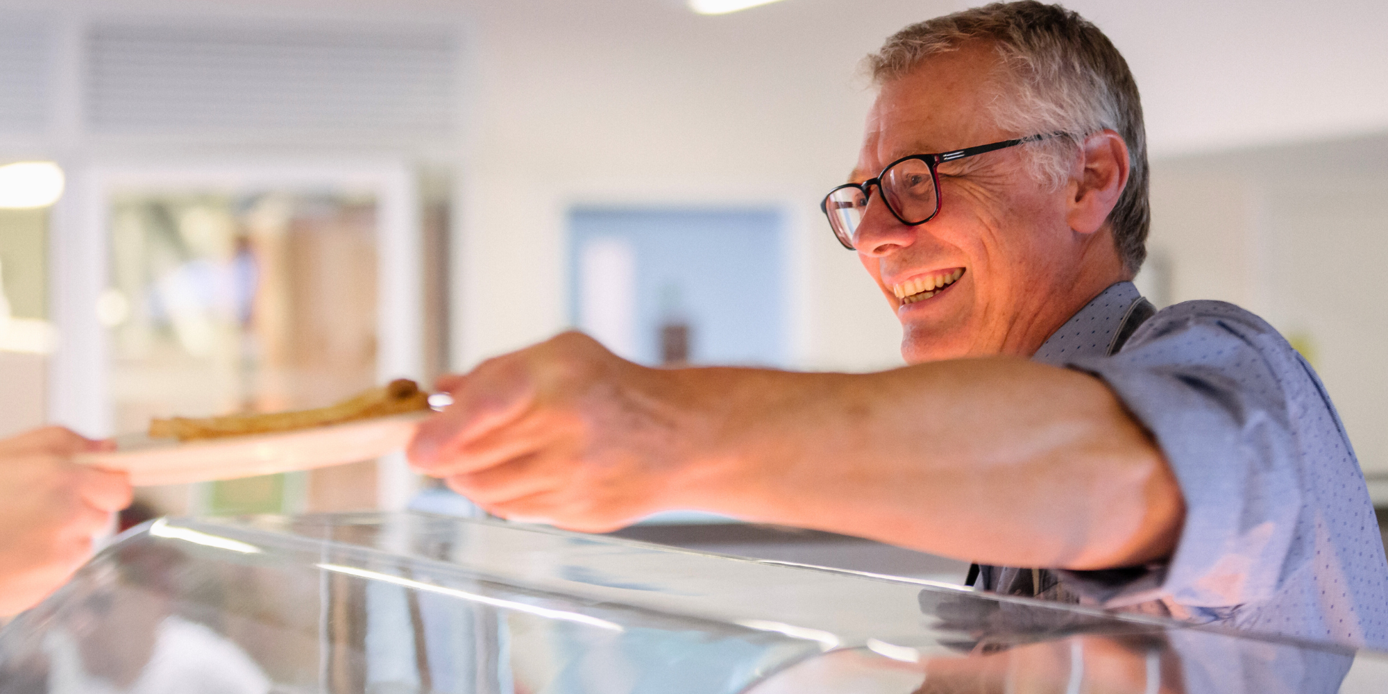 man serving food in our kitchen