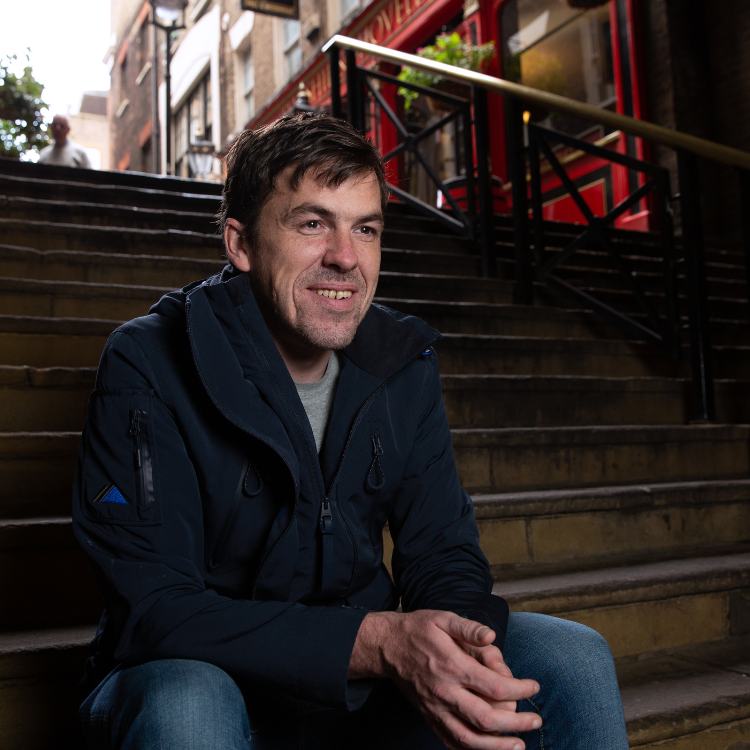 man smiling on stairs